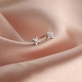 Elegant S925 sterling silver four-pointed star stud earrings with central sparkling gemstone - Four-Pointed Star Studs / White Gold