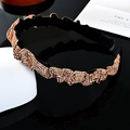 Baroque style wide headband with black fabric and shiny bronze rhinestones in wavy patterns - Champagne Rhinestone