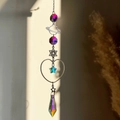 Detail of hanging crystal prism with planetary and star charms for garden decor - Planet Hexagram Heart