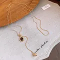 Double-layered gold Y-necklace with brown cat's eye stone pendant and metallic bead - 10# Necklace-Gold-Brown-Oval