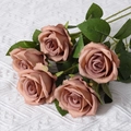 Single artificial pink purple velvet rose stem with green leaves on white fabric background - Coffee (Silk Version)