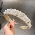 Detailed close-up of a wide headband with micro pearls and sparkling rhinestones - Iridescent Pearl
