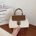 Chic cream and dark brown contrast-color trapezoid handbag with gold metal clasp closure - White
