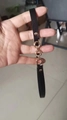 Close-up of black leather strap with gold metal ring links and rivet decorations - 56-58cm / Black Circle Connection Chain Decorative Band (AB82)