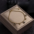 Elegant gold-plated stainless steel bead bracelet with three round black zircon stones - Gold - Black Zirconia