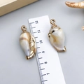 Two natural conch pendants with gold-plated edges and bicolor cloud textures - Electroplated Gold Cream Acrylic Conch 32x15x12mm (23615)