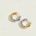 Detail of two-tone gold and silver chunky round hoop earrings with polished metal finish - Mixed Gold/Silver Hollow Hoop / Gold and Silver Two-tone