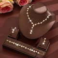 Elegant gold pearl necklace, bracelet and earrings set displayed on a jewelry stand - Gold Pearl Necklace Earrings Bracelet Kit (483+747)
