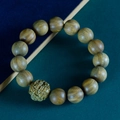 Green sandalwood bracelet with hand-carved Pixiu bead on minimalist textured background - Green Sandalwood Pixiu 15mm * 15 Beads