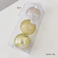 Dreiteiliges Set aus 8cm Weihnachtsbaumkugeln in Champagnergold mit Glitzer und Mustern - Hellgold
