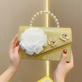 Gold glitter evening clutch featuring white fabric flowers and a vintage pearl top handle - Gold