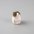 Detailed view of a hand-carved wooden cat figurine with brown and white painted textures - Wood Carved Ragdoll Cat Ornament