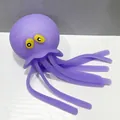 Jouet sensoriel pieuvre en silicone violet avec yeux jaunes et tentacules souples - Poulpe Violet