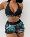 Close-up of tropical leaf print on high-waisted boyshort bikini bottoms with black top - S / Multi-color 1