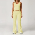 Pale yellow yoga set featuring a halter crop top and high-waist drawstring flare pants - S / Top And Bottom / Bud Yellow