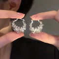 Irregular textured C-shaped silver stud earrings with unique radial spike pattern finish - Style 22 Silver Radial Pattern