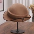 Detailed close-up of brown wool felt bowler hat with a vintage metal side buckle - M(56-58cm) / Camel