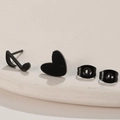 Close-up of matte black stainless steel asymmetric earrings with music note and heart shapes - 678 Black (Heart & Note)