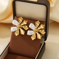 Exaggerated floral coral stud earrings in gold and silver finish on a display box - Two-Tone Irregular Metallic Flower Style (KE119656-SP)