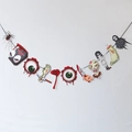 Detail of Halloween banner featuring zombie motifs and blood splatter party decorations - Spider and Eyeball Banner