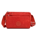 Red multi-pocket nylon crossbody bag with adjustable strap and layered zipper design - Bengala Red