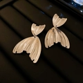 Detailed view of silver fish-tail earrings featuring a polished metallic texture and fringe - 38# S925 Silver Post Silver Fishtail Earrings (Large)