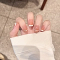 French tip press-on nails in nude pink with rhinestone accents and glossy finish - Extra Small (XS) / Extra Short Trapezoid (2194)