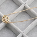 Macro detail of gold snake chain necklace featuring a colorful heart crystal pendant - Colorful Heart Circle Necklace