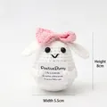 Handmade crochet positive bunny doll holding encouragement card with pink bow detail - Bunny with Bow H Card