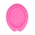 Pink oval silicone mold featuring a vintage embossed flower frame for fondant cake decorating - Pink
