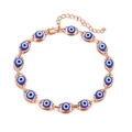 Detail of rose gold evil eye bracelet with adjustable chain and thirteen blue charms - Rose Gold Base Blue