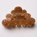 Pince à cheveux ambre ondulée ornée de strass marron étincelants sur fond blanc - Café Clair
