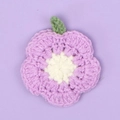 Handmade crochet purple flower keychain with white center and green loop detail - Purple Crochet Flower
