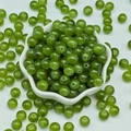 Macro shot of 8mm green glass jade round beads in white ceramic flower bowl for DIY - 4mm / Olive Green