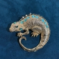 Golden lizard brooch with light blue gemstones and green rhinestone eyes on blue velvet - Spine Inlaid Gemstone Large Lizard Brooch / Gold