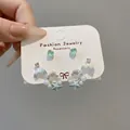 Detail of ocean-themed earring set with sea star, shell charms and pearl hoop earrings - 3# Silver and Blue (6 Pairs)