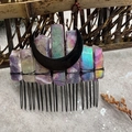 Close-up of handmade bridal hair comb with natural amethyst crystals and black moon decor - Aura Amethyst Black Moon