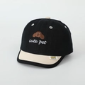 Detailed view of a cartoon puppy baby hat with stylish color block peaked cap brim - Style 3 Black