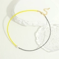 Close-up of bohemian beaded necklace with yellow and black glass beads and freshwater pearl - Yellow And Black (NE2143-D)