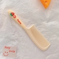Cute cream yellow hairbrush with 3D strawberry detail and long handle for girls - Strawberry