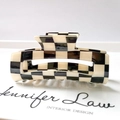 Detail view of the black and white checkerboard hair claw clip made of glossy acetate - 13# Black Beige Checkerboard