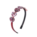 Detail showing four multi-color sequined heart charms on a black non-slip headband - Black Base Multicolor Sequined Heart