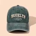 Close-up of vintage dark green baseball cap with Brooklyn 1947 embroidery detail - Green