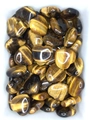 Macro shot of polished heart-shaped tiger's eye stones with golden silky luster - Tiger's Eye