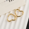 Elegant gold heart-shaped hoop earrings in a minimalist polished finish with hinge closure - Heart Earrings / Gold