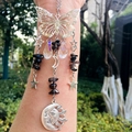 Detail of silver suncatcher with crystal drops, butterfly frame and moon pendant - Smoky Quartz