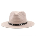 Detail of light beige straw fedora featuring a black leather band with silver metal studs - Pink