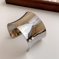 Detailed close-up of a silver irregular concave open bangle with a polished mirror finish - Silver Mirror Minimalist Wide Cuff Style