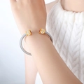 Silver cable cuff bracelet with gold accents and a red central gemstone with zircon pavé - Z235-Red Zirconia Double Layer