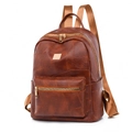 Brown faux leather commute backpack with gold hardware and side pockets in 45-degree view - Brown